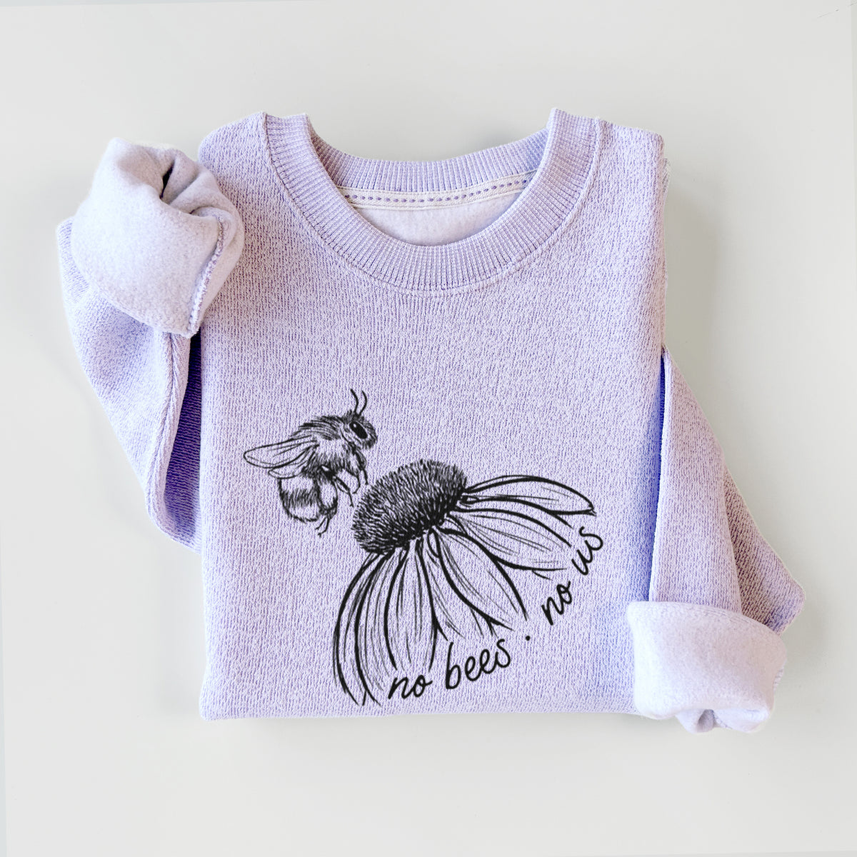 Ice purple knit sweatshirt printed with a black ink illustration of a bee flying toward a coneflower, with the handwritten words no bees no us, styled flat.