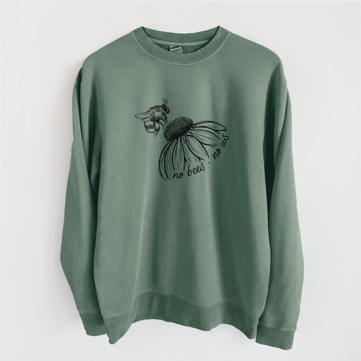 Alpine green pigment dyed crewneck sweatshirt laid flat, printed with a black ink illustration of a bee flying toward a coneflower, with the handwritten words no bees no us.