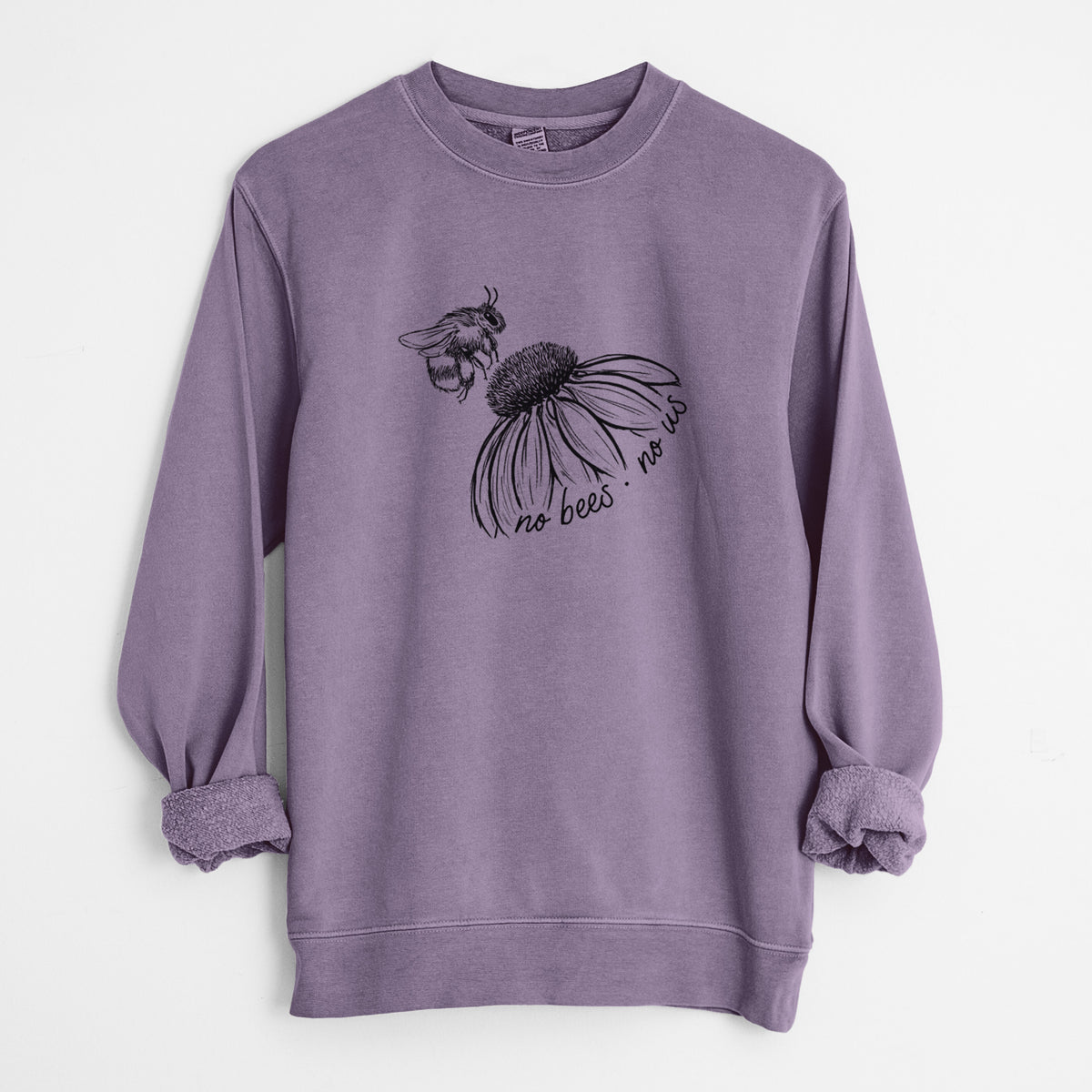 Plum purple pigment dyed crewneck sweatshirt laid flat with the sleeves rolled, printed with a black ink illustration of a bee flying toward a coneflower, with the handwritten words no bees no us.