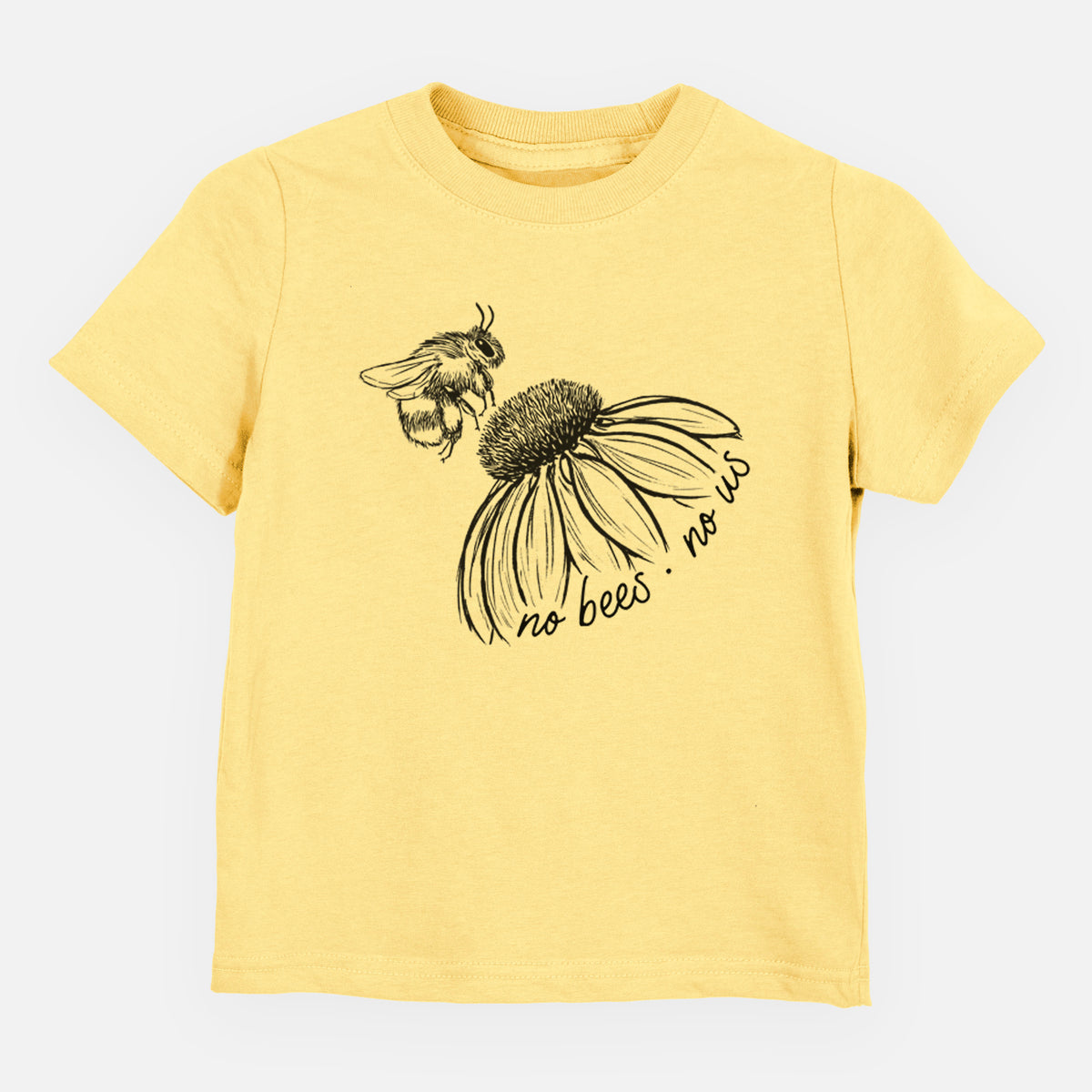 Butter yellow toddler t-shirt laid flat, printed with a black ink illustration of a bee flying toward a coneflower, with the handwritten words no bees no us.