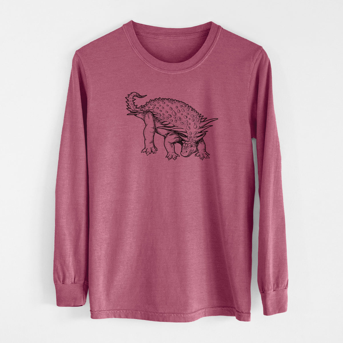 Crimson Comfort Colors long sleeve shirt laid flat, printed with a black ink illustration of an armored Nodosaurus.