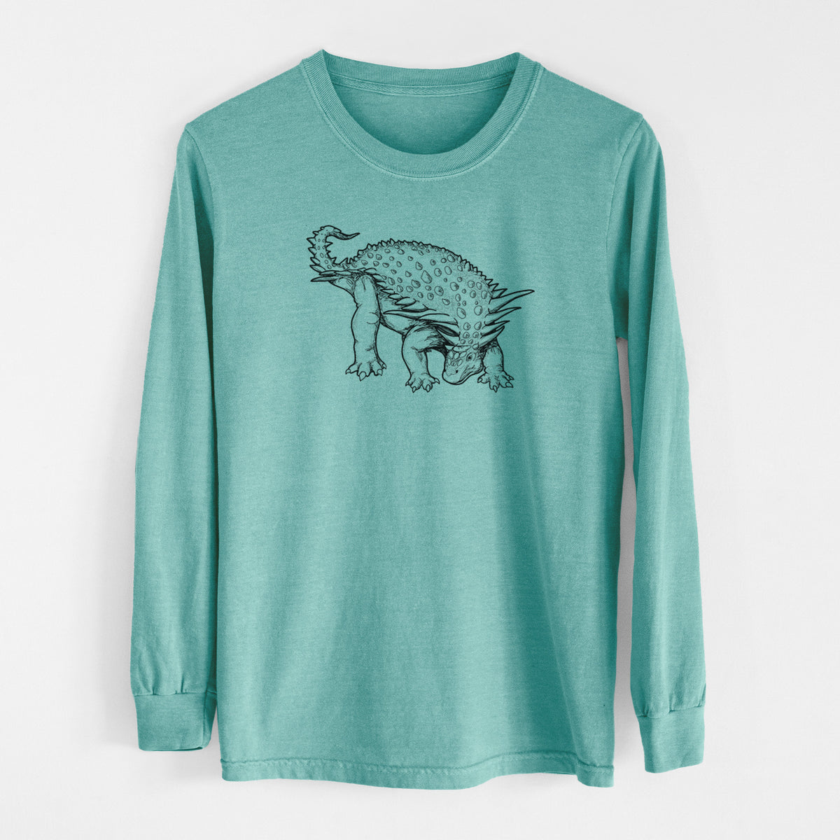 Reef green Comfort Colors long sleeve shirt laid flat, printed with a black ink illustration of an armored Nodosaurus.