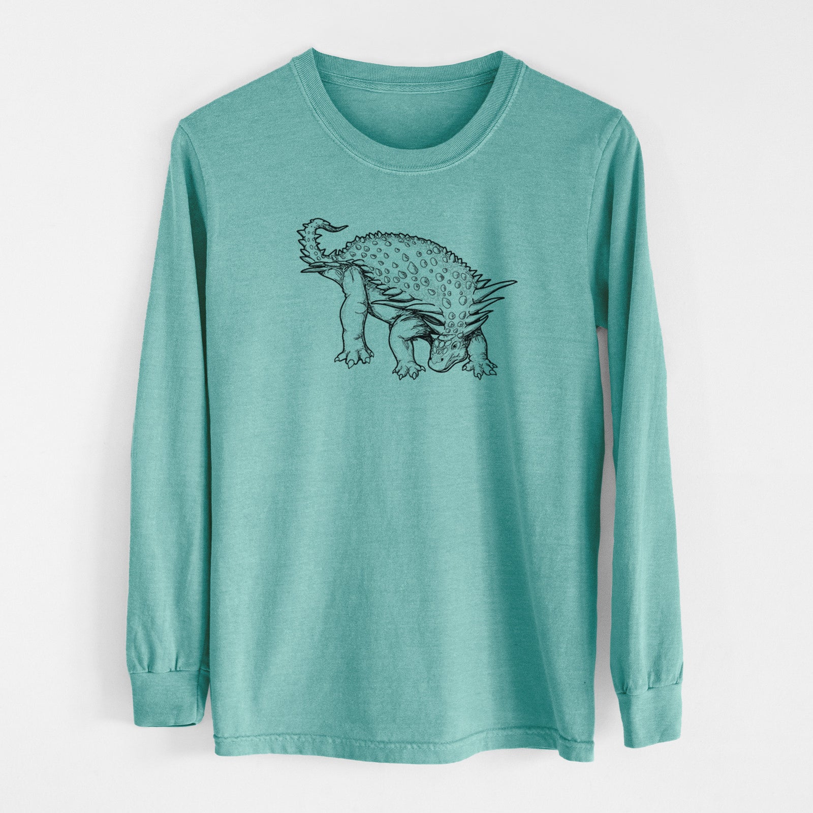 Reef green Comfort Colors long sleeve shirt laid flat, printed with a black ink illustration of an armored Nodosaurus.