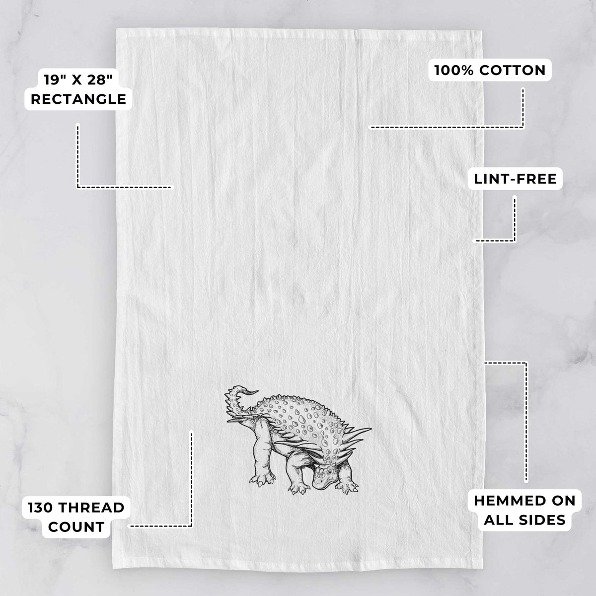 White tea towel printed with a black ink illustration of an armored Nodosaurus, with feature labels: 19 by 28 inch rectangle, 100% cotton, lint-free, 130 thread count, hemmed on all sides.