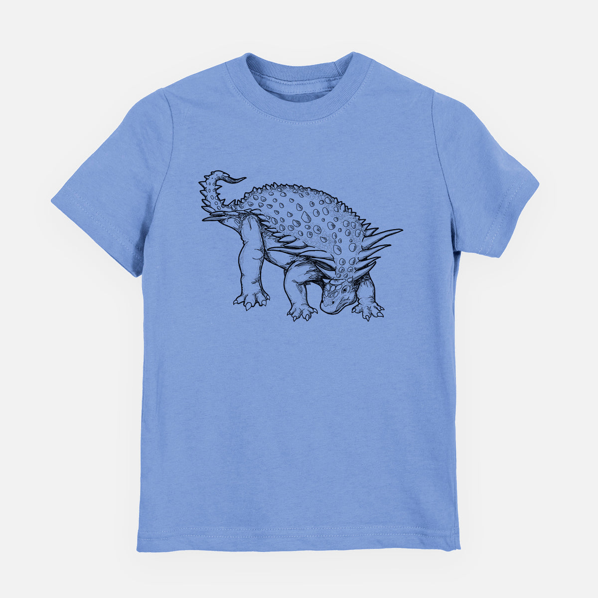 Carolina blue youth t-shirt laid flat, printed with a black ink illustration of an armored Nodosaurus.