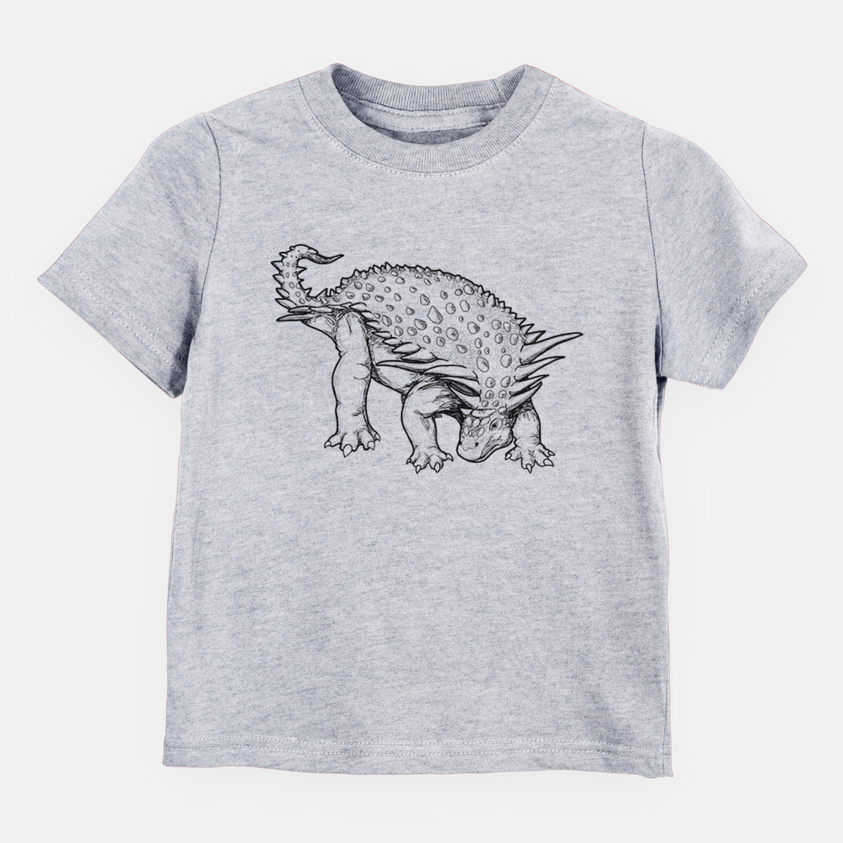 Heather grey toddler t-shirt laid flat, printed with a black ink illustration of an armored Nodosaurus.