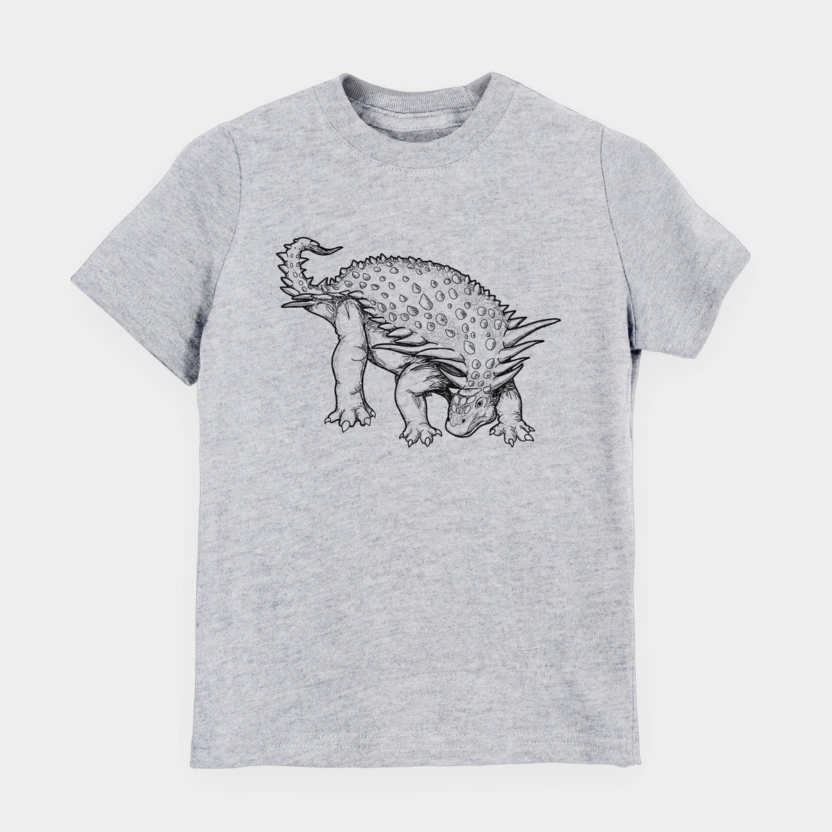 Heather grey youth t-shirt laid flat, printed with a black ink illustration of an armored Nodosaurus.
