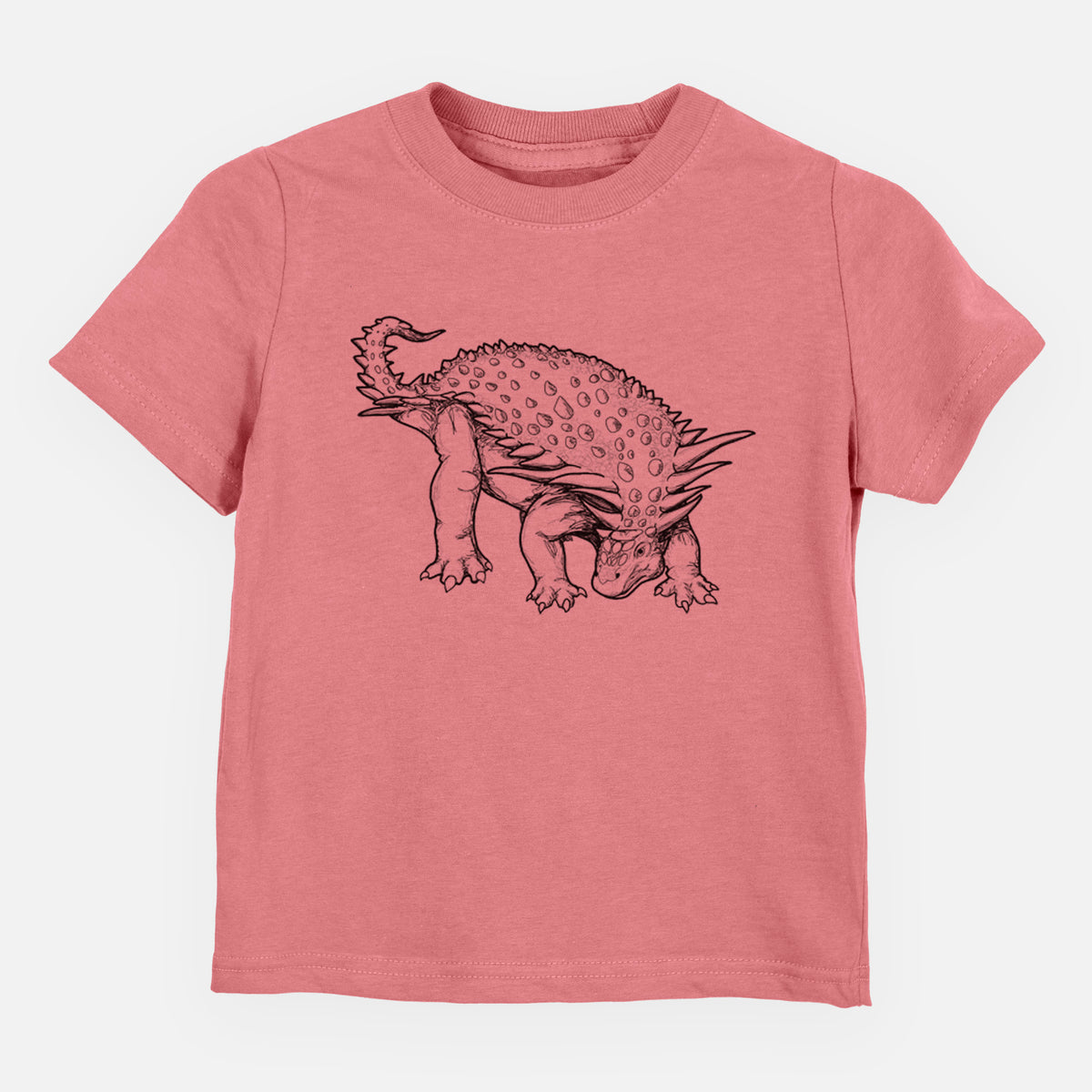 Mauve pink toddler t-shirt laid flat, printed with a black ink illustration of an armored Nodosaurus.