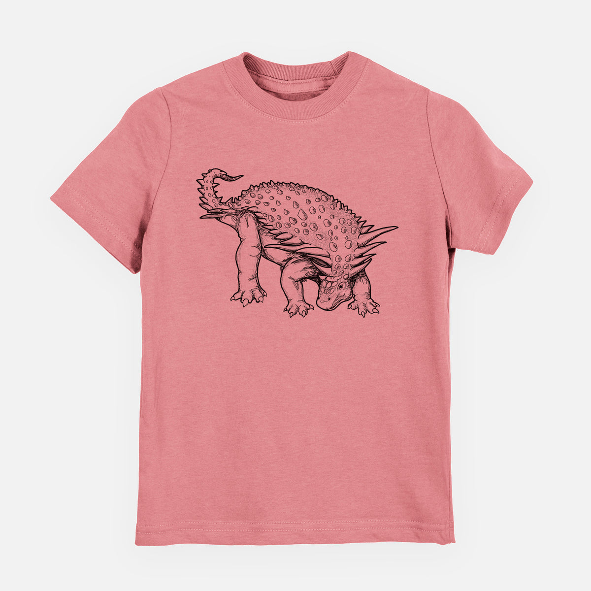 Mauve pink youth t-shirt laid flat, printed with a black ink illustration of an armored Nodosaurus.