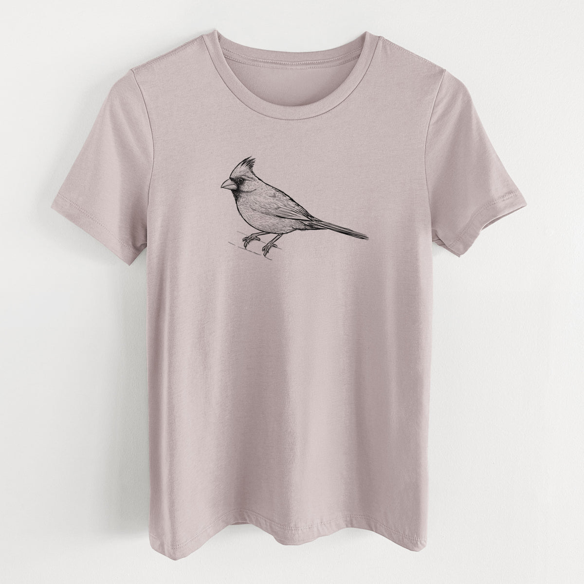 Pink gravel women's relaxed fit cotton t-shirt laid flat, printed with a detailed black ink sketch of a northern cardinal perched with its crest raised.