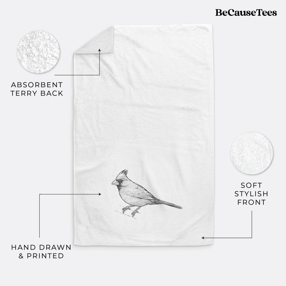 White hand towel printed with a detailed black ink sketch of a northern cardinal perched with its crest raised.