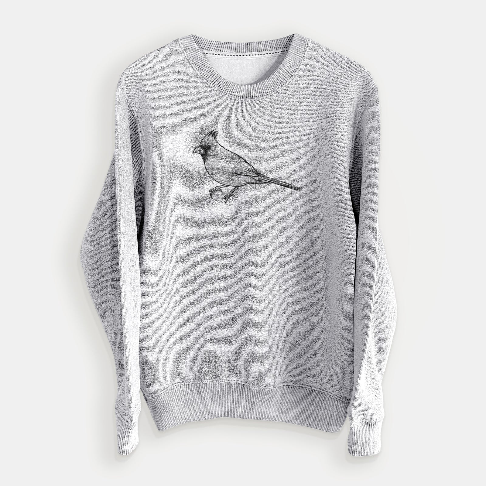 Salt and pepper knit sweatshirt laid flat, printed with a detailed black ink sketch of a northern cardinal perched with its crest raised.