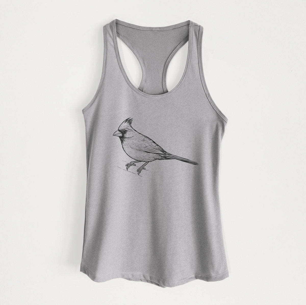 Heather grey women's racerback tank top laid flat, printed with a detailed black ink sketch of a northern cardinal perched with its crest raised.