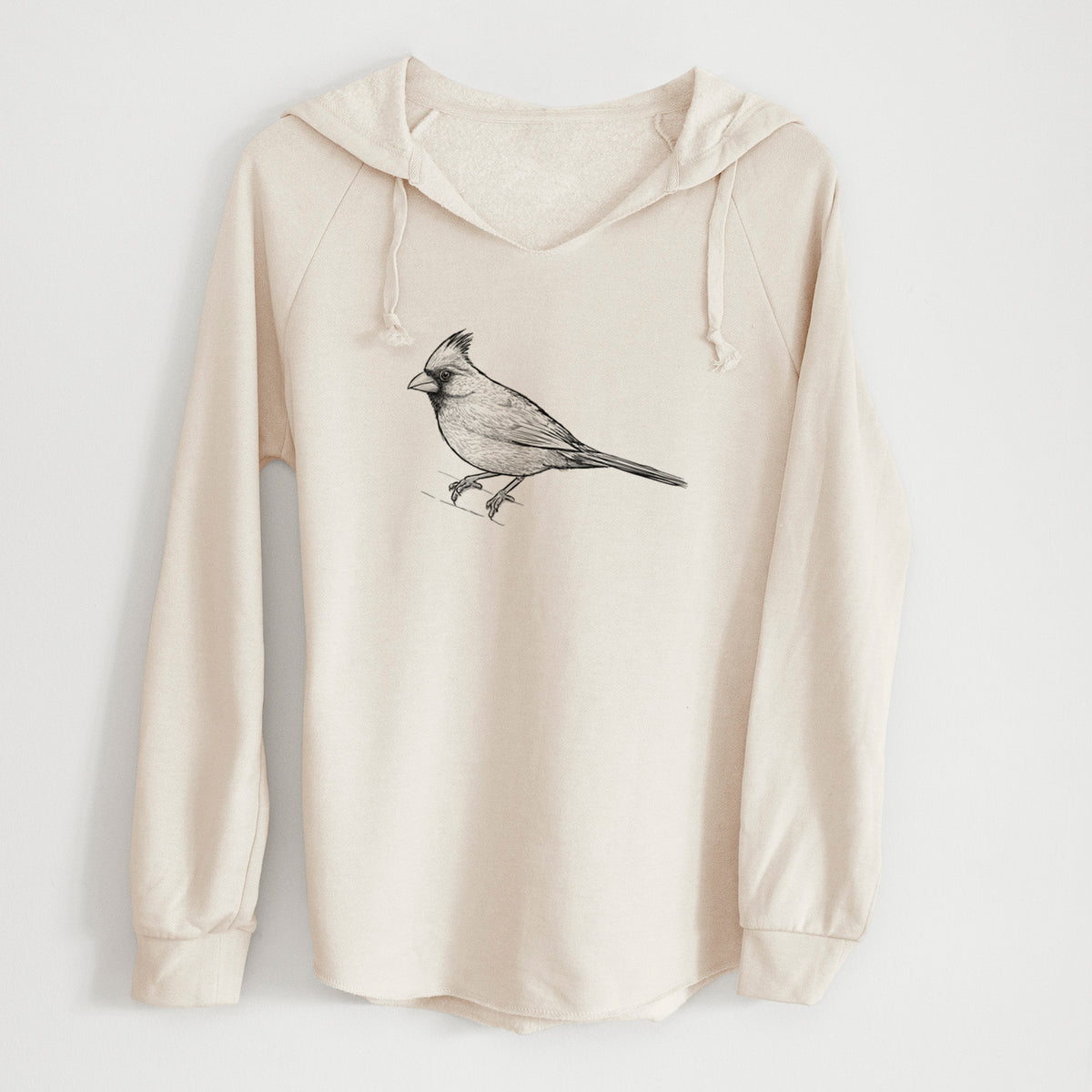 Bone cream women's Cali Wave hooded sweatshirt laid flat, printed with a detailed black ink sketch of a northern cardinal perched with its crest raised.
