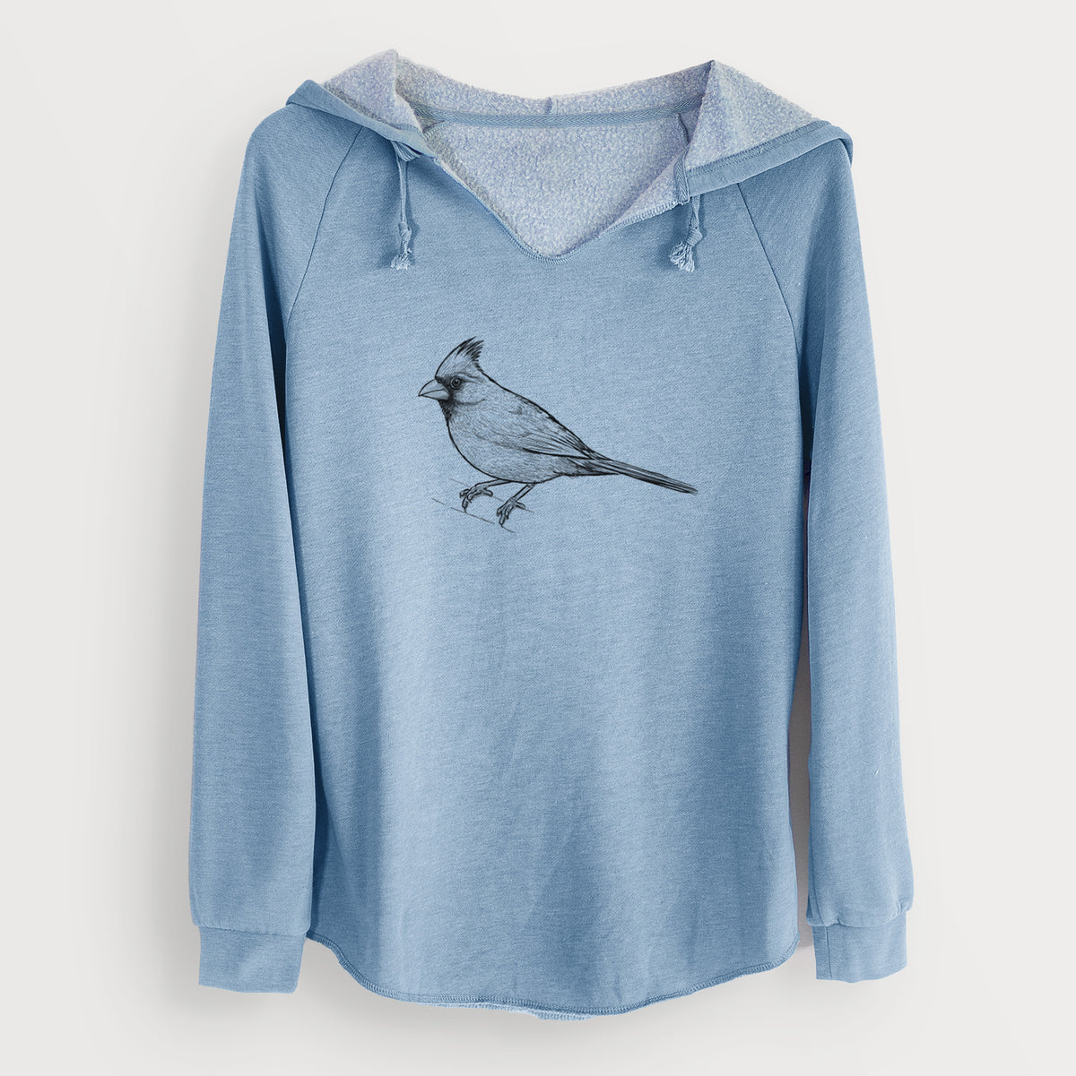 Misty blue women's Cali Wave hooded sweatshirt laid flat, printed with a detailed black ink sketch of a northern cardinal perched with its crest raised.