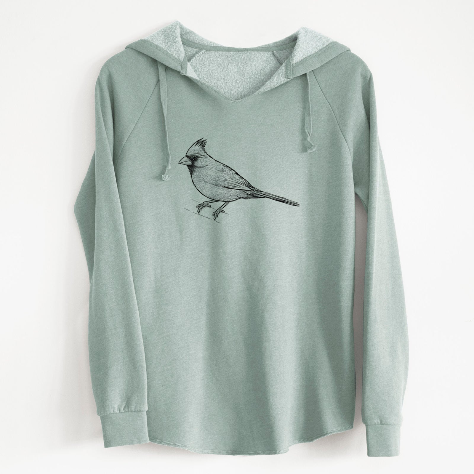Sage green women's Cali Wave hooded sweatshirt laid flat, printed with a detailed black ink sketch of a northern cardinal perched with its crest raised.