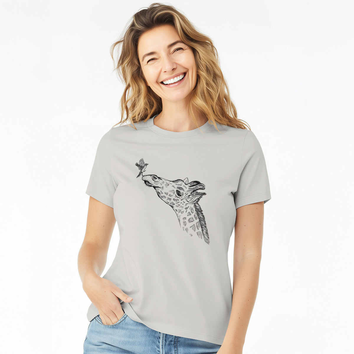 Woman wearing a lunar grey women's relaxed fit cotton t-shirt printed with a black ink illustration of a northern giraffe reaching its head up to nibble a flower.