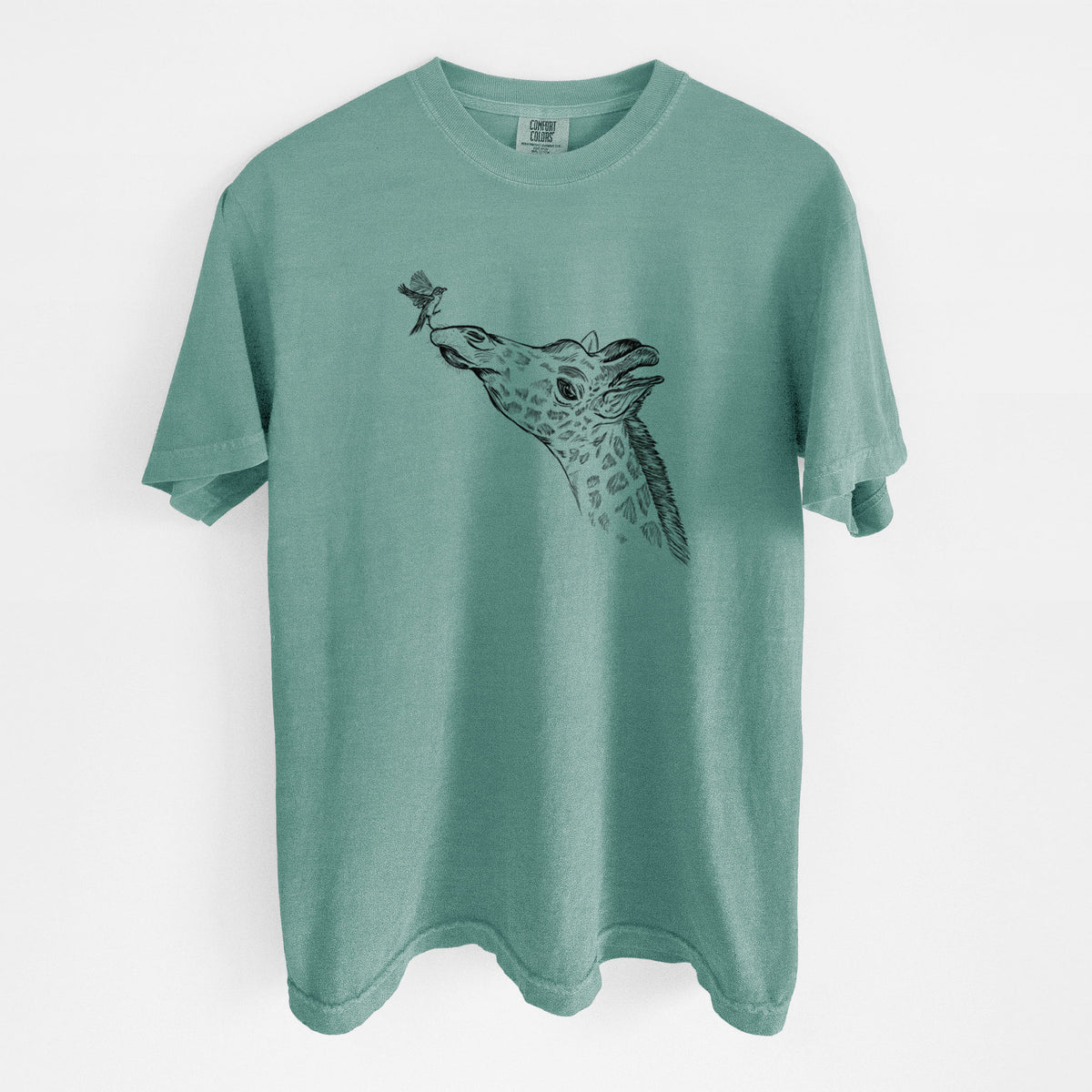 Reef green Comfort Colors t-shirt laid flat, printed with a black ink illustration of a northern giraffe reaching its head up to nibble a flower.