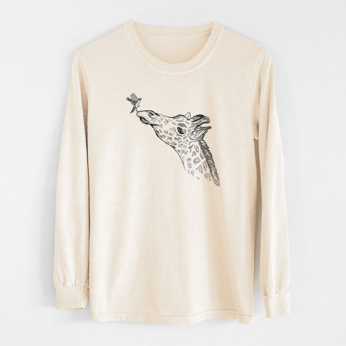 Ivory Comfort Colors long sleeve shirt laid flat, printed with a black ink illustration of a northern giraffe reaching its head up to nibble a flower.