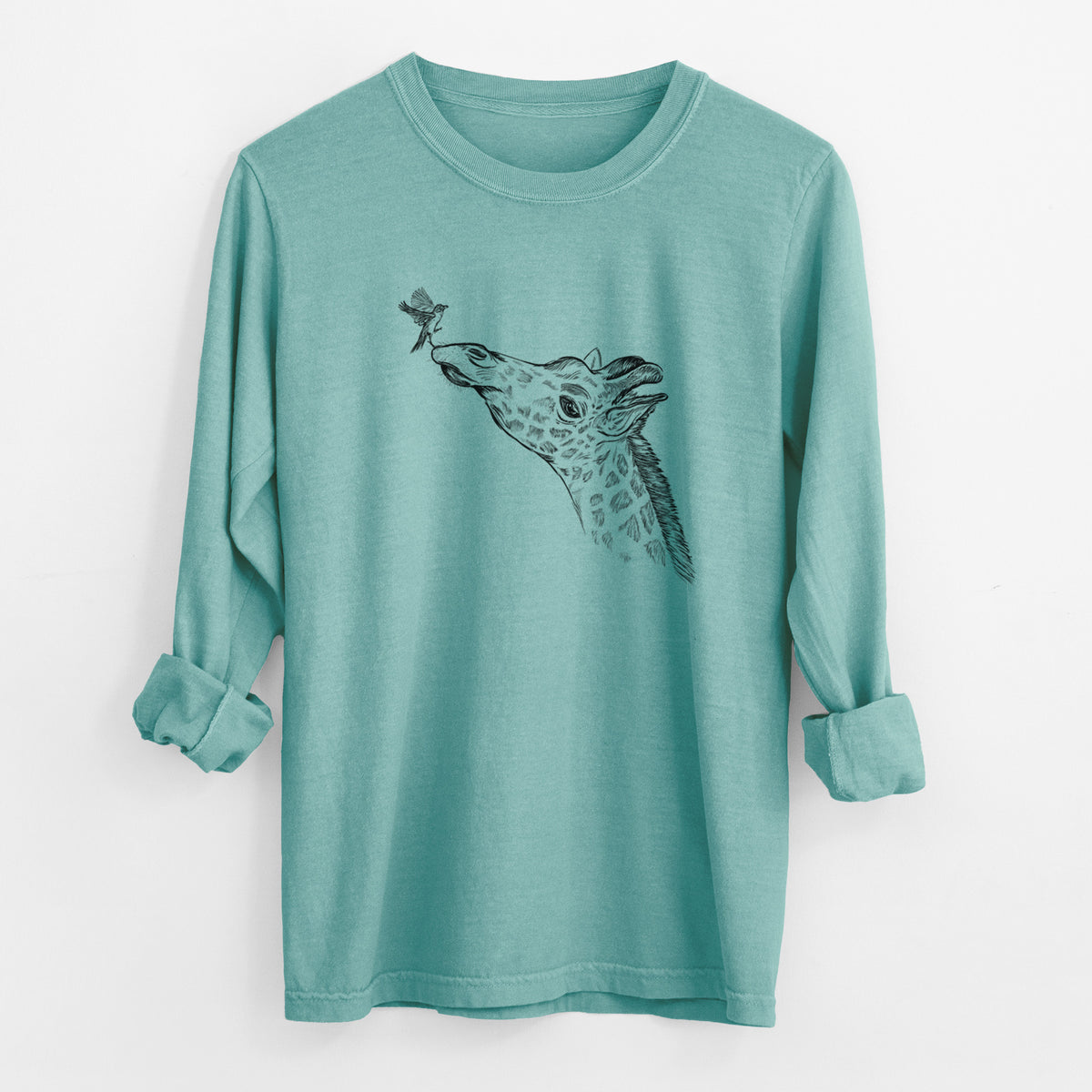 Reef green Comfort Colors long sleeve shirt laid flat with the cuffs rolled, printed with a black ink illustration of a northern giraffe reaching its head up to nibble a flower.