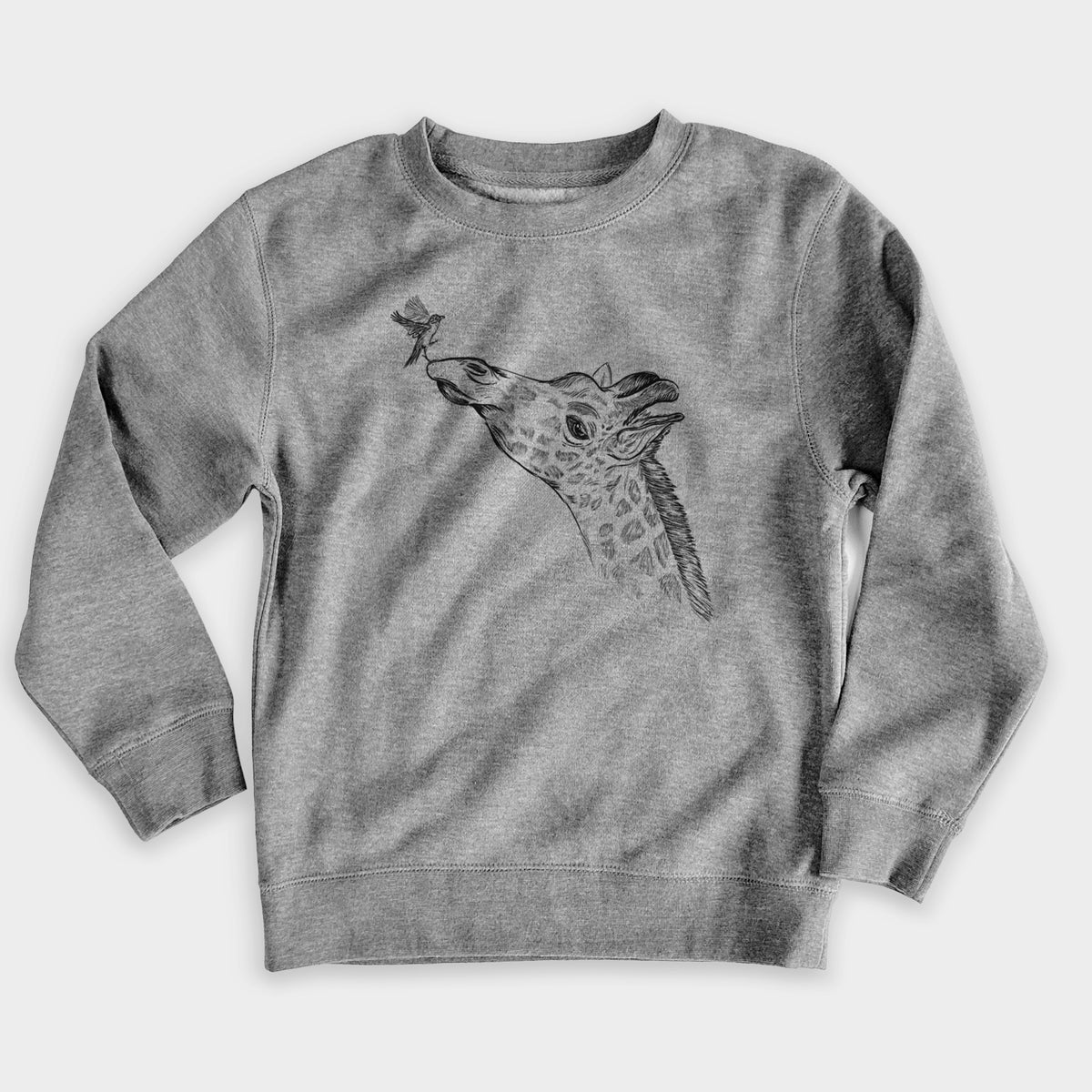 Nickel grey youth crewneck sweatshirt laid flat, printed with a black ink illustration of a northern giraffe reaching its head up to nibble a flower.