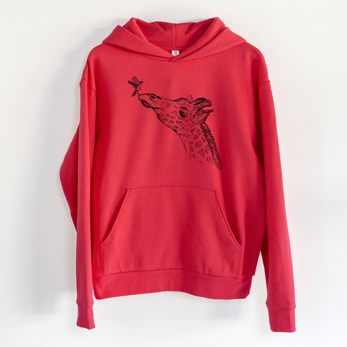 Northern Giraffe - Giraffa camelopardalis - Statement Midweight Hoodie in Cherry Red, hanging on a white wall, with a front kangaroo pocket and no drawcords.
