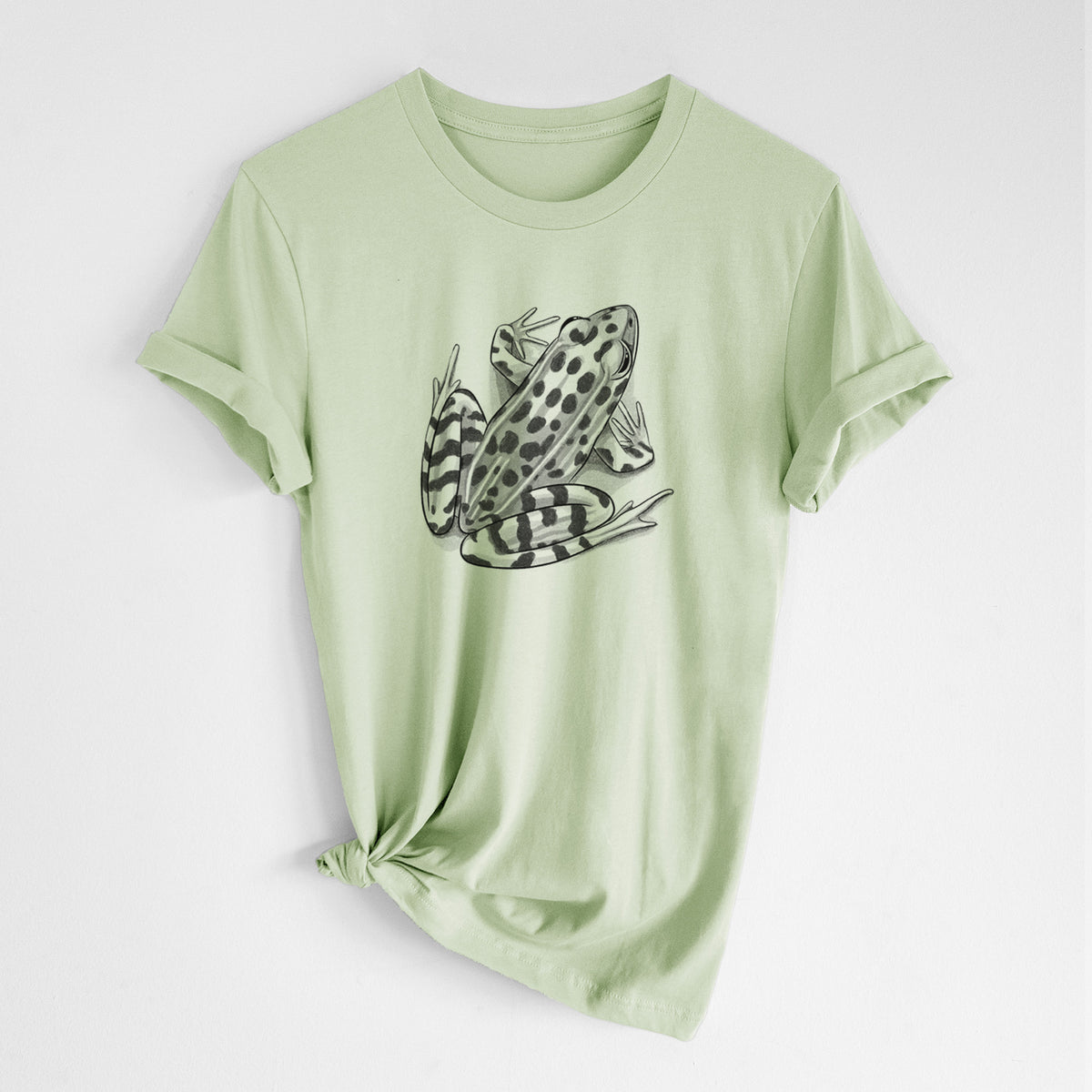 Spring green lightweight cotton t-shirt laid flat with the sleeves rolled, printed with a detailed black ink illustration of a spotted northern leopard frog.