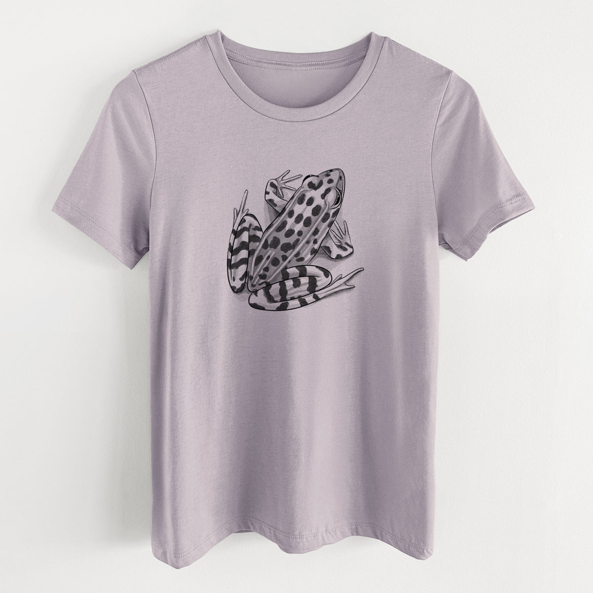 Light violet women's relaxed fit cotton t-shirt laid flat, printed with a detailed black ink illustration of a spotted northern leopard frog.
