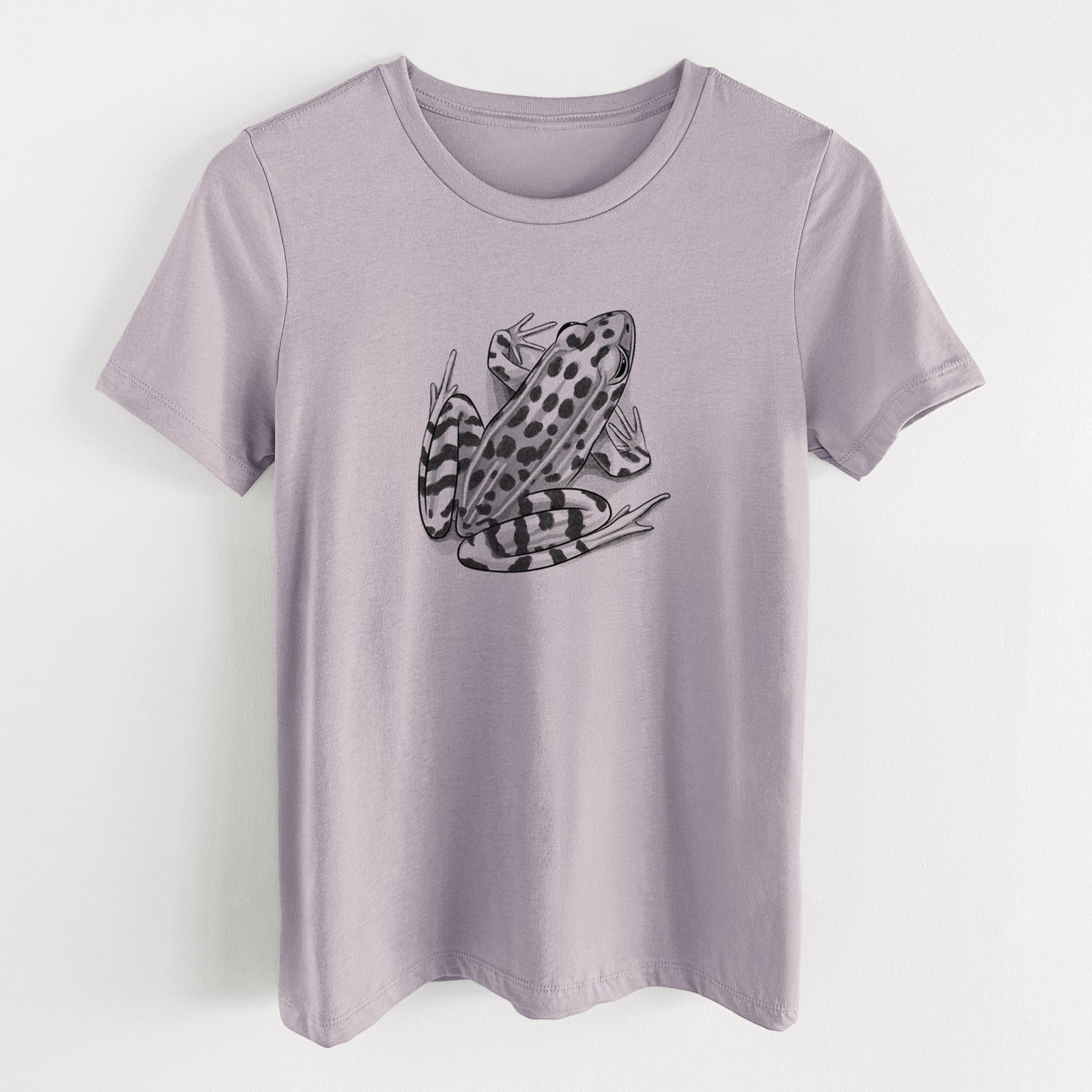 Light violet women's relaxed fit cotton t-shirt laid flat, printed with a detailed black ink illustration of a spotted northern leopard frog.