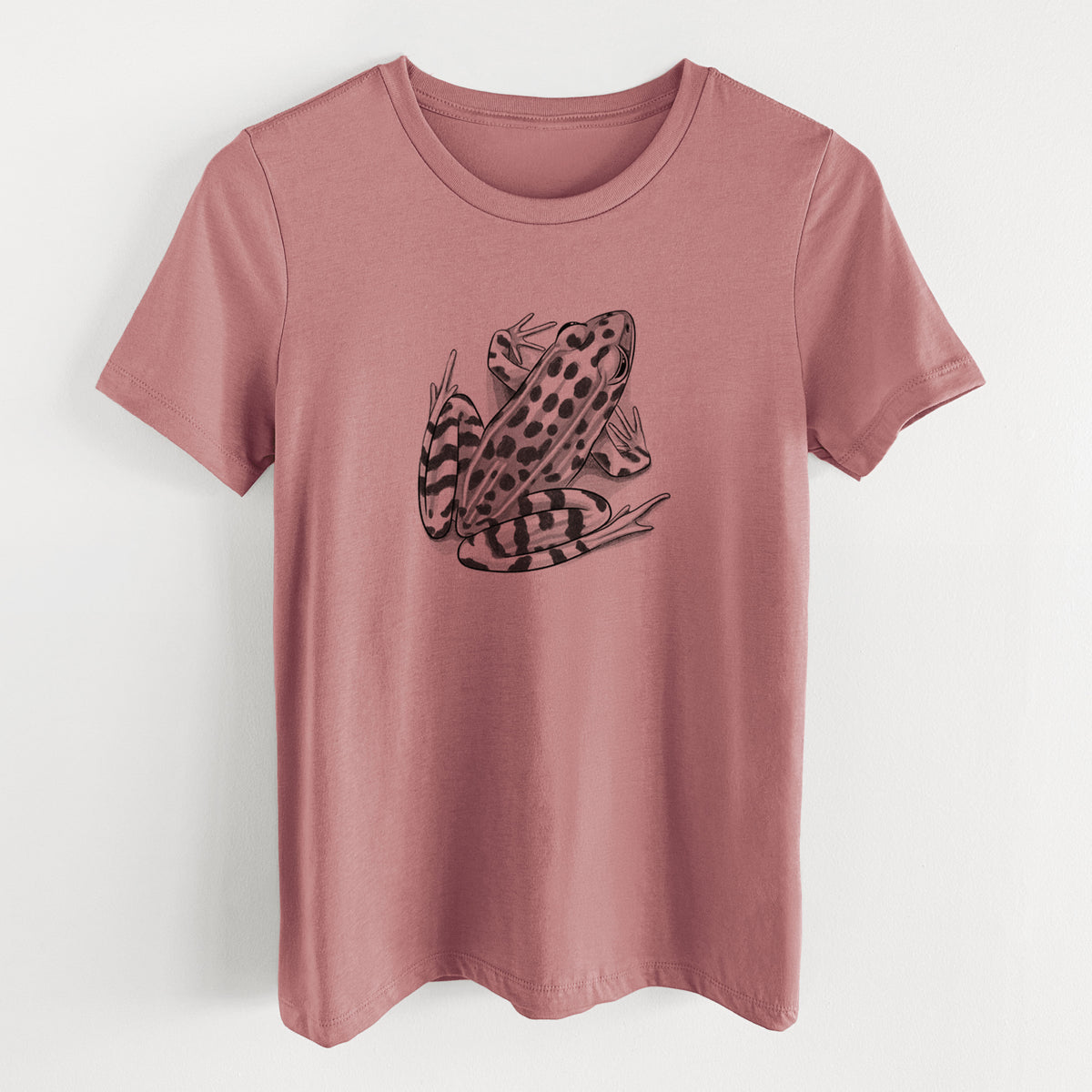 Mauve pink women's relaxed fit cotton t-shirt laid flat, printed with a detailed black ink illustration of a spotted northern leopard frog.