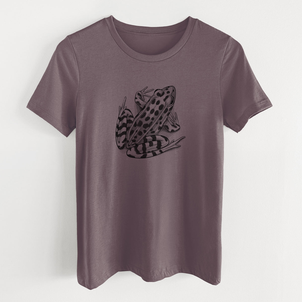 Purple storm women's relaxed fit cotton t-shirt laid flat, printed with a detailed black ink illustration of a spotted northern leopard frog.