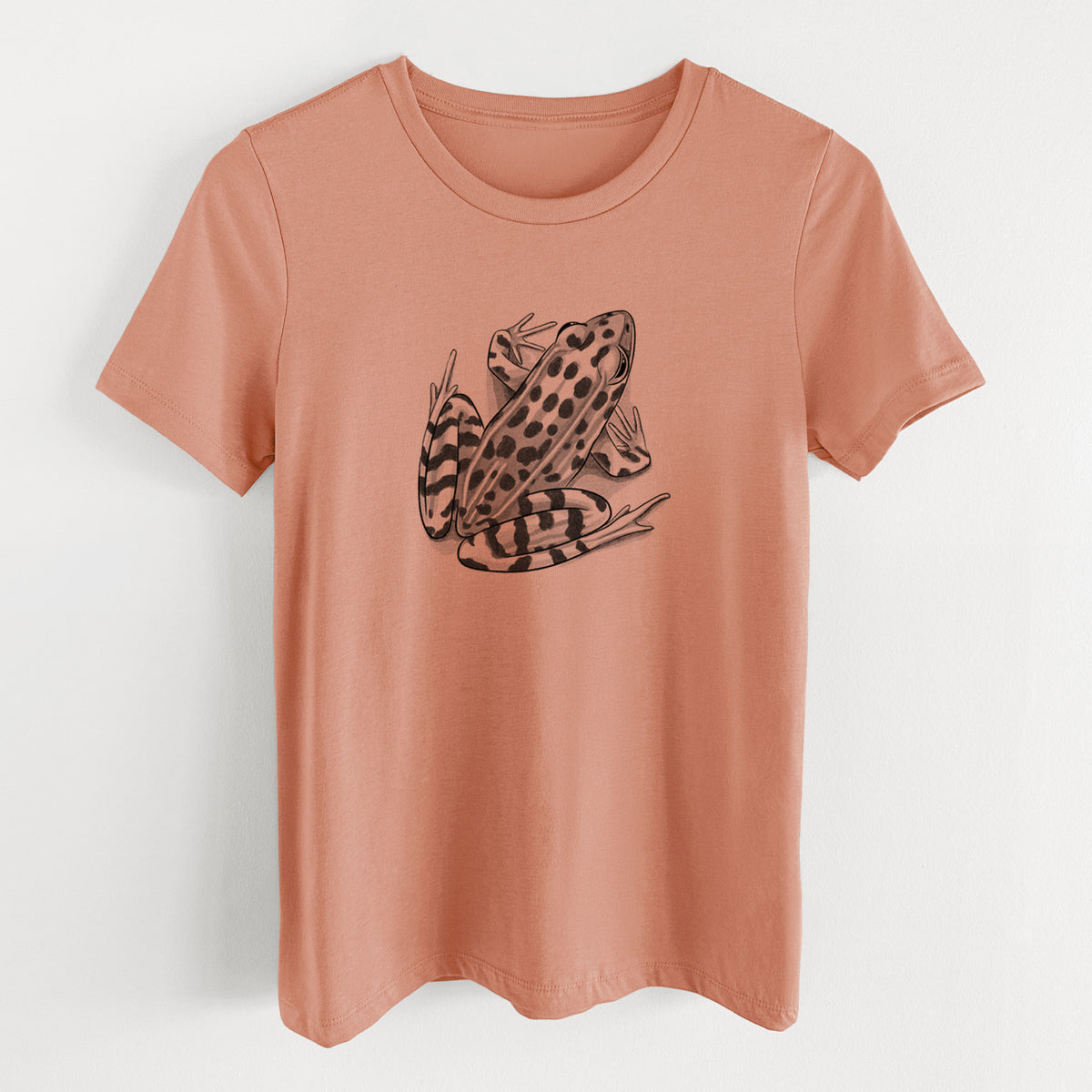 Terracotta orange women's relaxed fit cotton t-shirt laid flat, printed with a detailed black ink illustration of a spotted northern leopard frog.