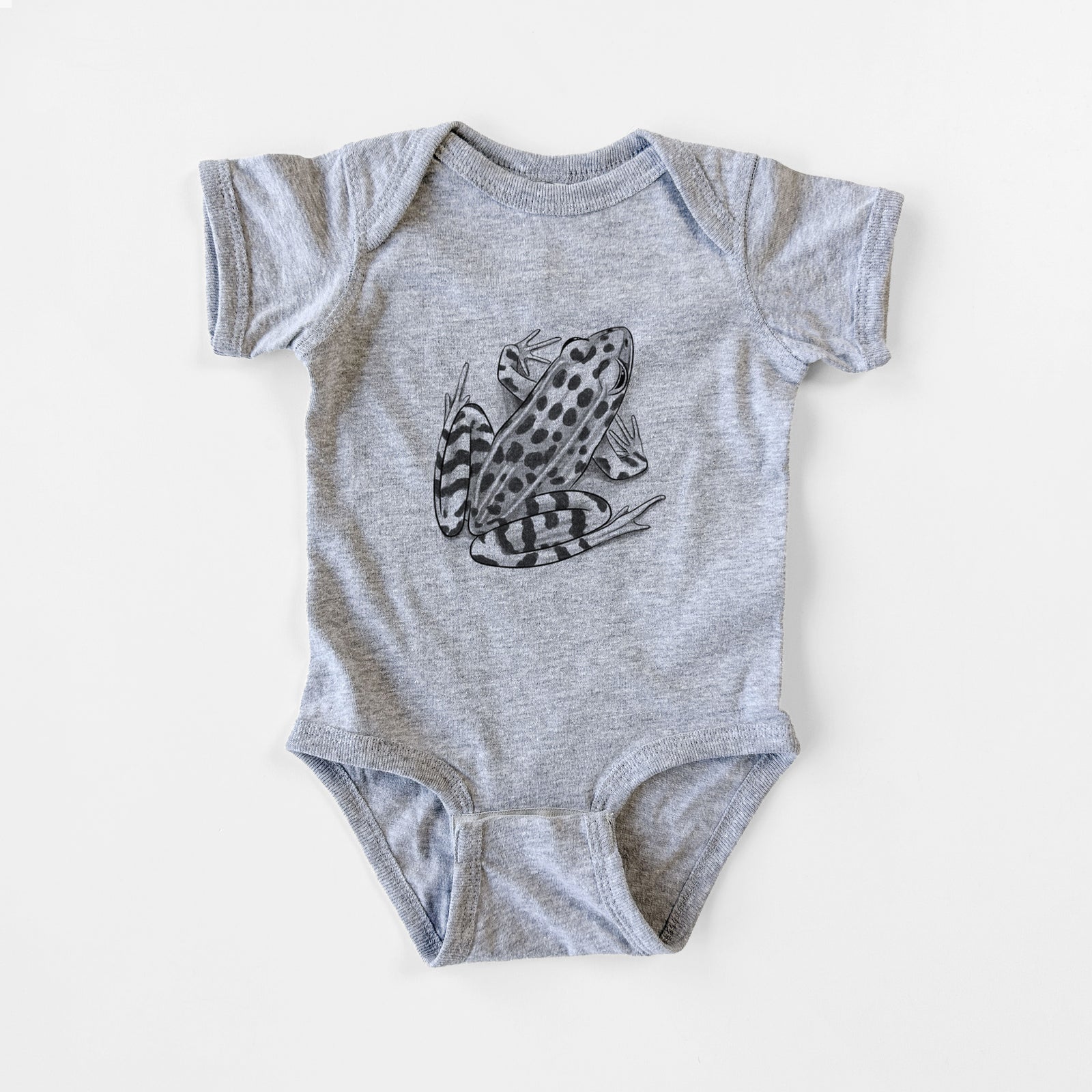 Grey baby bodysuit laid flat, printed with a detailed black ink illustration of a spotted northern leopard frog.