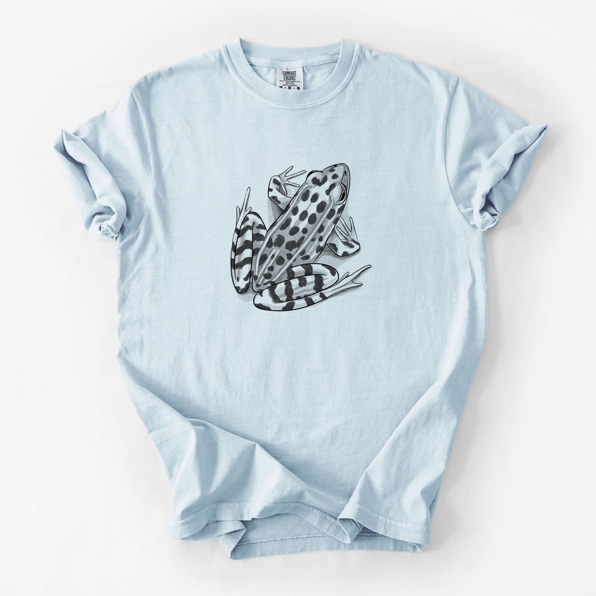 Chambray blue Comfort Colors t-shirt laid flat, printed with a detailed black ink illustration of a spotted northern leopard frog.