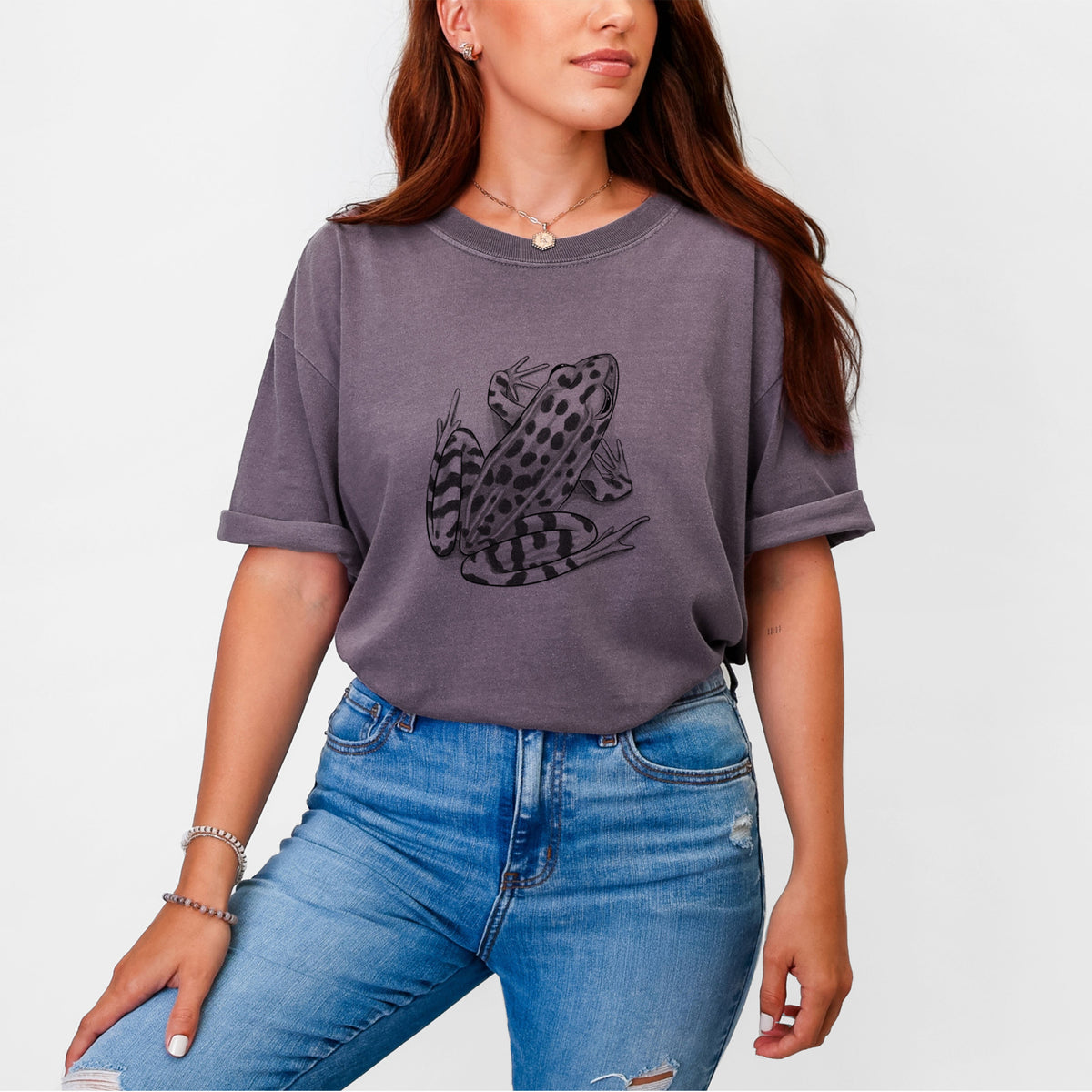 Woman wearing a Comfort Colors t-shirt printed with a detailed black ink illustration of a spotted northern leopard frog.