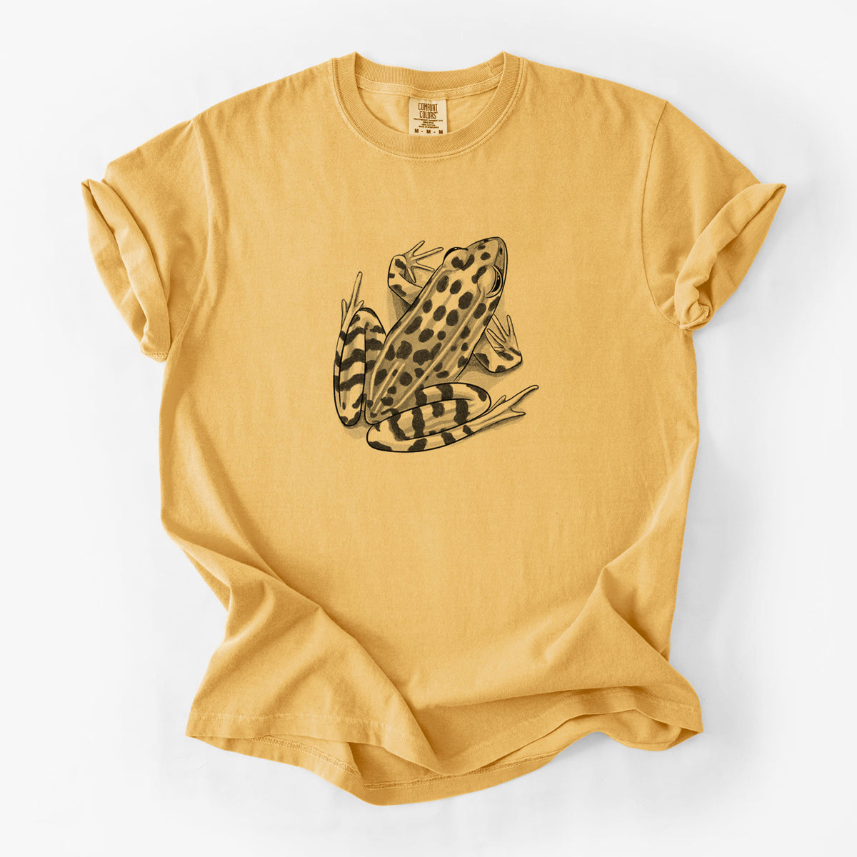 Golden wheat yellow Comfort Colors t-shirt laid flat, printed with a detailed black ink illustration of a spotted northern leopard frog.