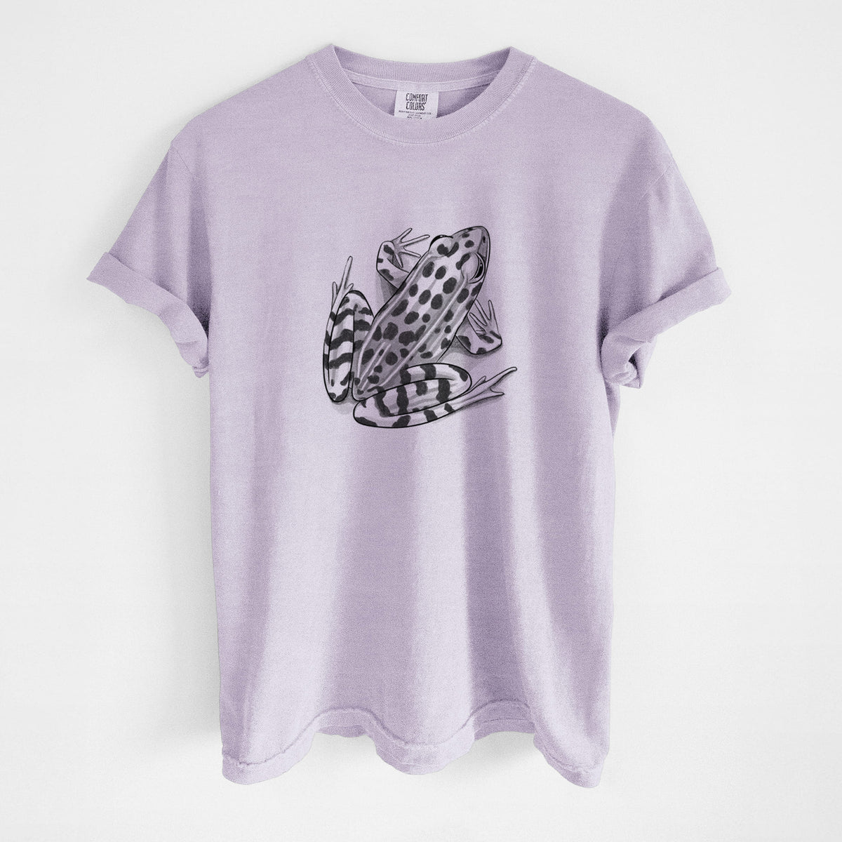 Orchid purple Comfort Colors t-shirt laid flat, printed with a detailed black ink illustration of a spotted northern leopard frog.