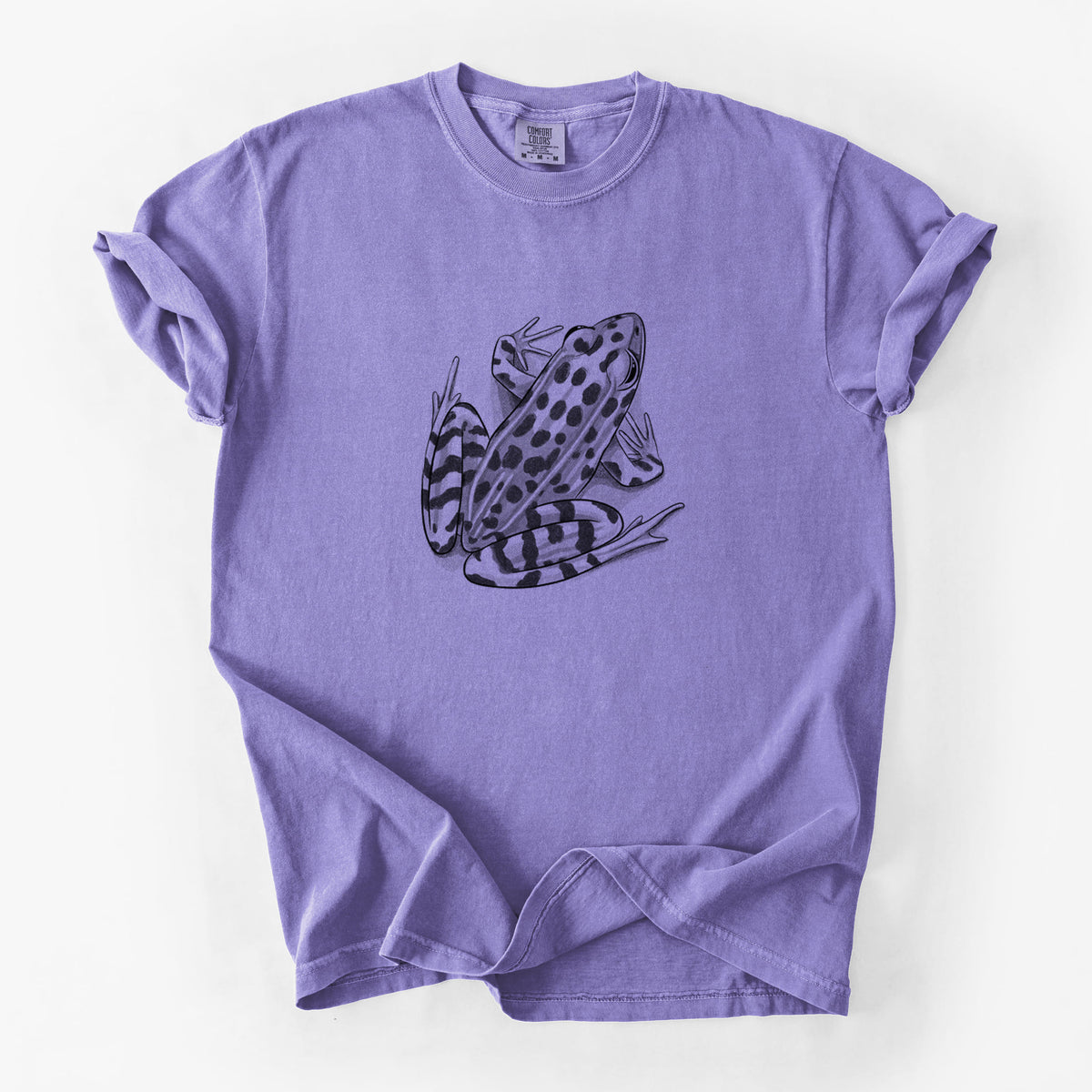 Violet purple Comfort Colors t-shirt laid flat, printed with a detailed black ink illustration of a spotted northern leopard frog.