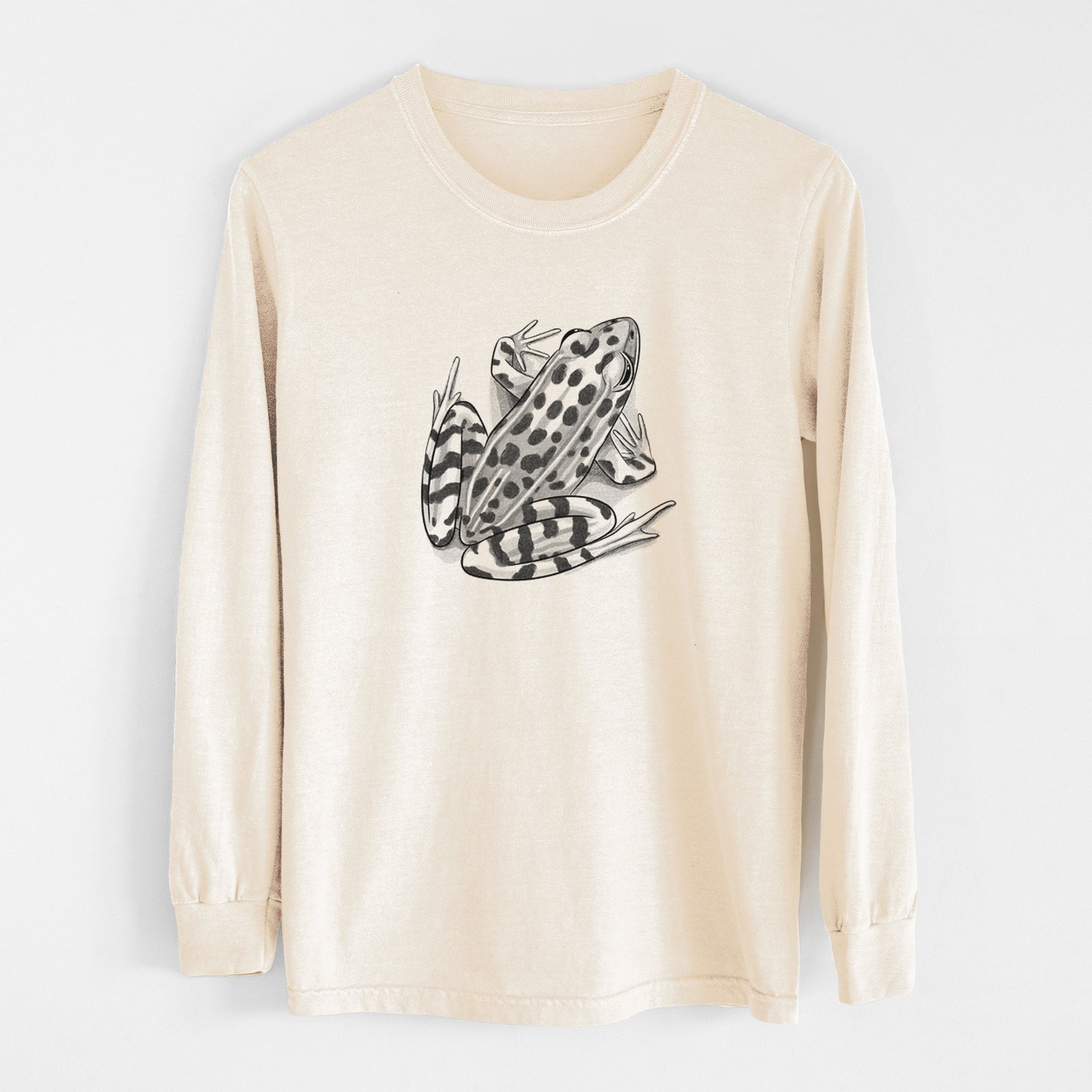Ivory Comfort Colors long sleeve shirt laid flat, printed with a detailed black ink illustration of a spotted northern leopard frog.