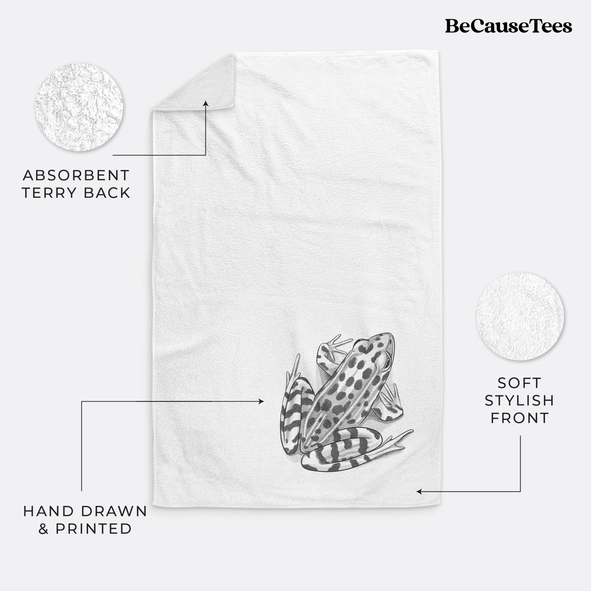 White hand towel printed with a detailed black ink illustration of a spotted northern leopard frog.