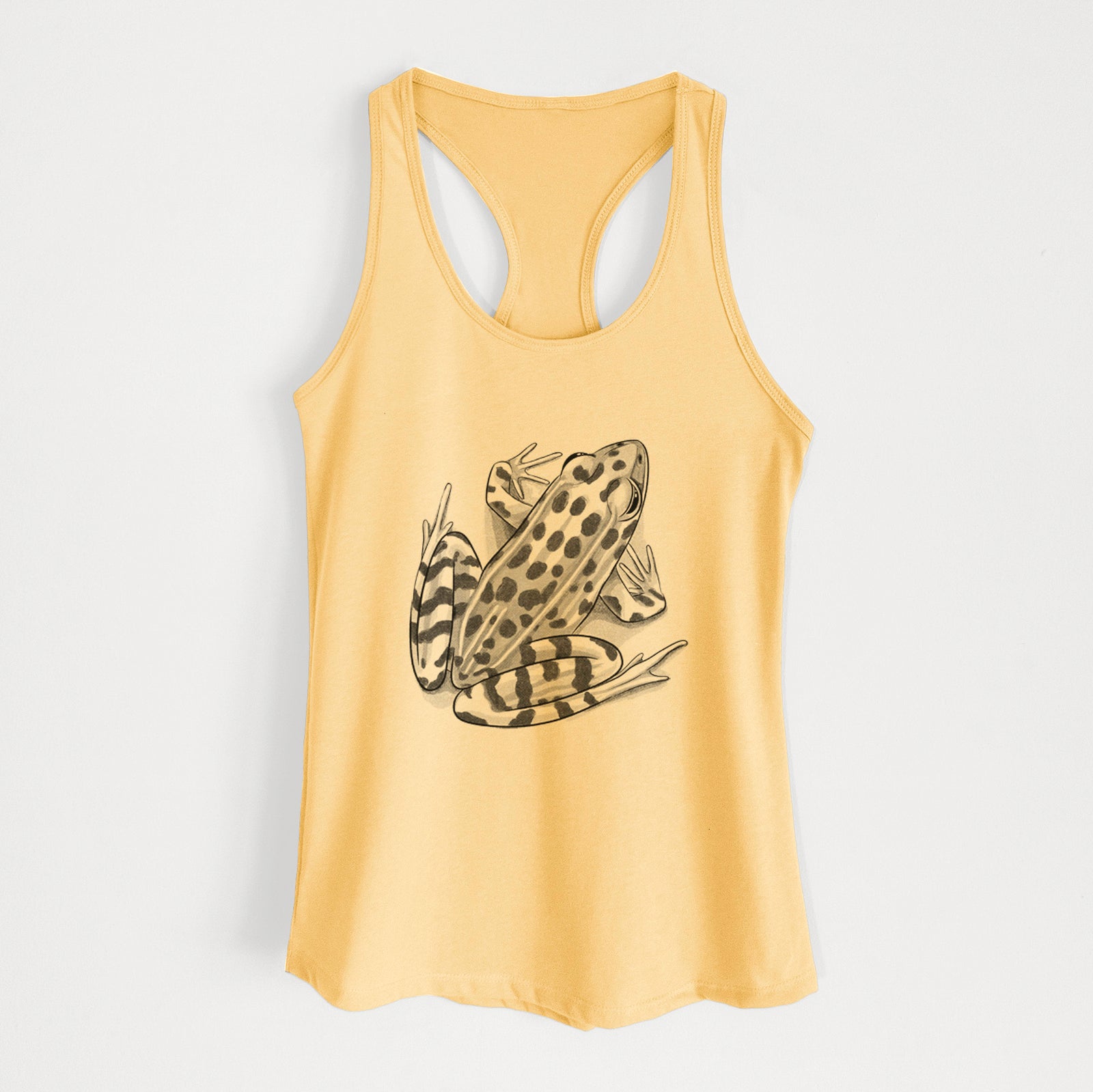 Banana cream women's racerback tank top laid flat, printed with a detailed black ink illustration of a spotted northern leopard frog.