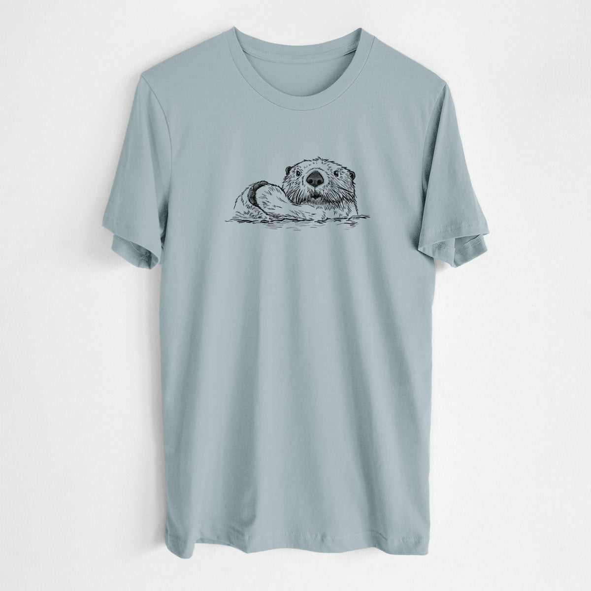 Vintage denim lightweight cotton t-shirt laid flat, printed with a black ink illustration of a northern river otter peeking out of the water.