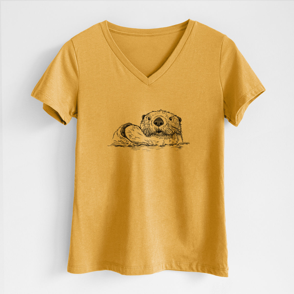 Honeycomb yellow women's relaxed fit cotton V-neck t-shirt laid flat, printed with a black ink illustration of a northern river otter peeking out of the water.