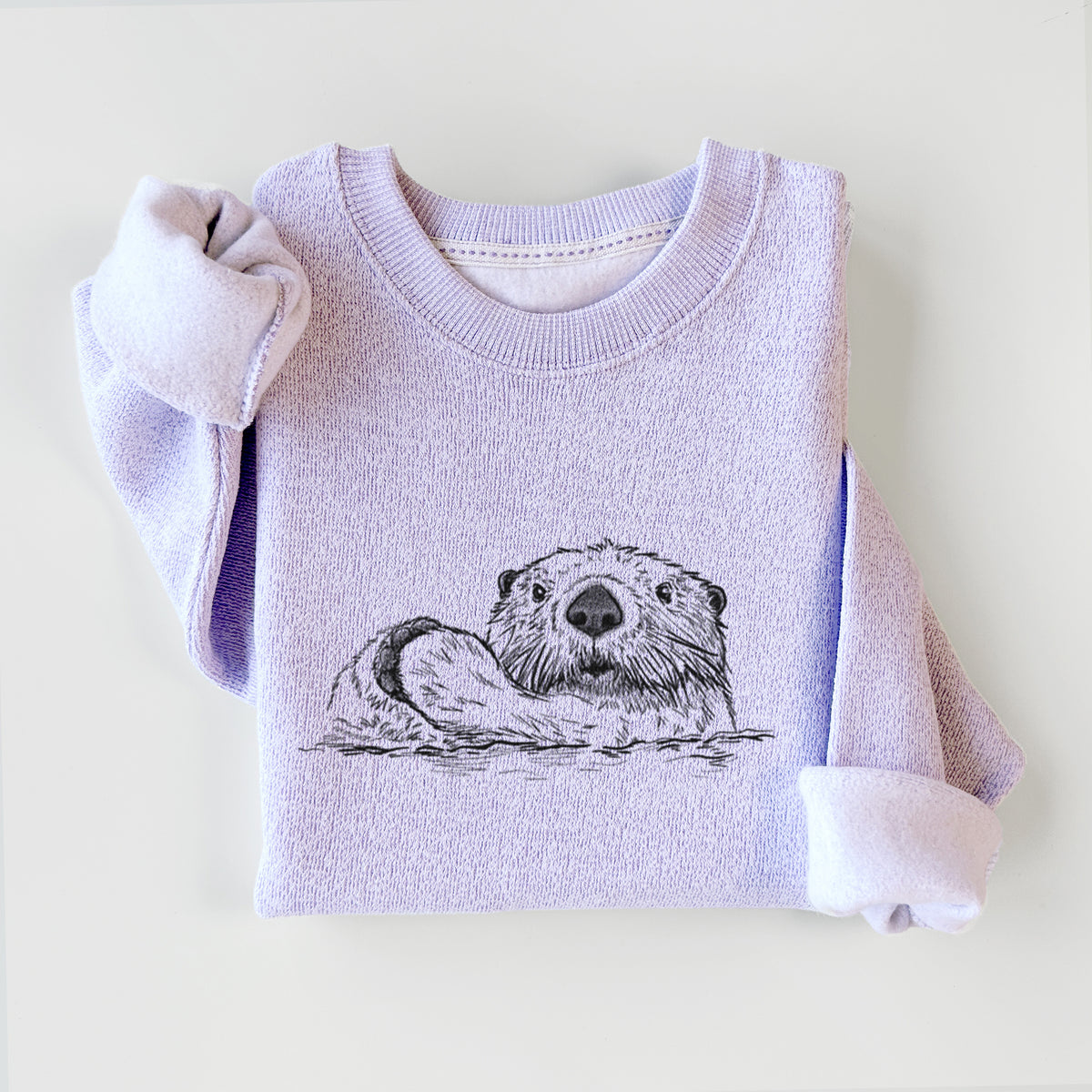 Ice purple knit sweatshirt printed with a black ink illustration of a northern river otter peeking out of the water, styled flat.