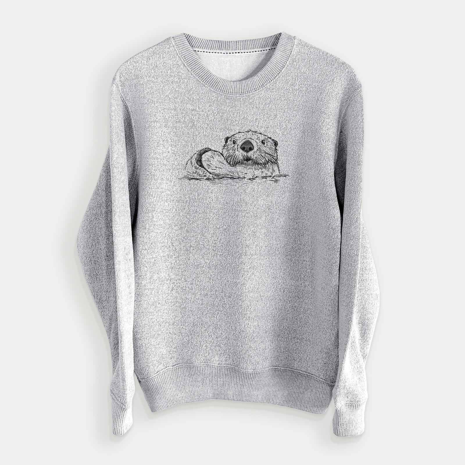 Salt and pepper knit sweatshirt laid flat, printed with a black ink illustration of a northern river otter peeking out of the water.