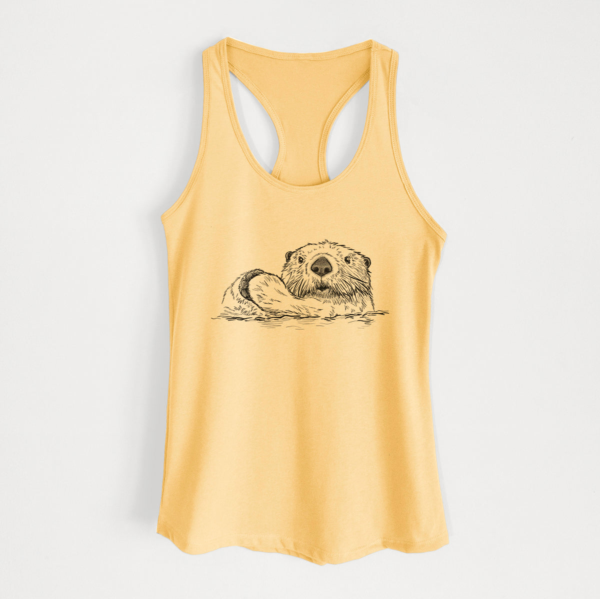Banana cream women's racerback tank top laid flat, printed with a black ink illustration of a northern river otter peeking out of the water.