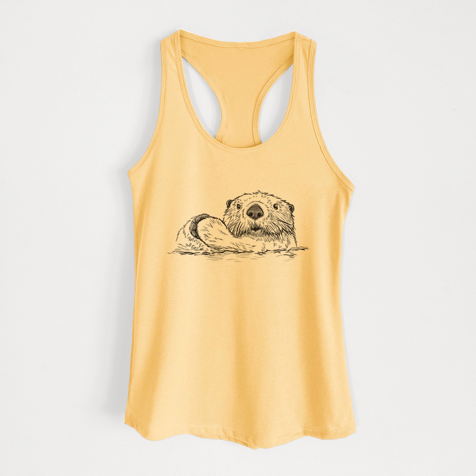 Banana cream women's racerback tank top laid flat, printed with a black ink illustration of a northern river otter peeking out of the water.
