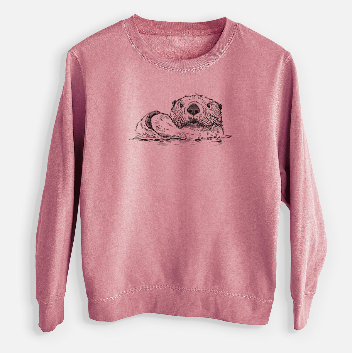 Mauve pink youth crewneck sweatshirt laid flat, printed with a black ink illustration of a northern river otter peeking out of the water.