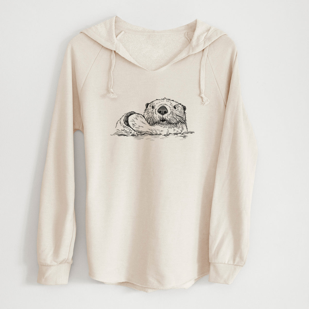 Bone cream women's Cali Wave hooded sweatshirt laid flat, printed with a black ink illustration of a northern river otter peeking out of the water.