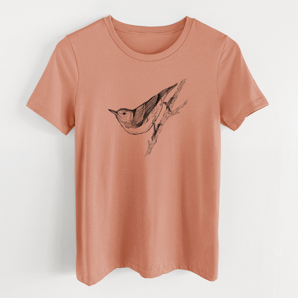 Terracotta orange women's relaxed fit cotton t-shirt laid flat, printed with a detailed black ink sketch of a nuthatch clinging to a branch.